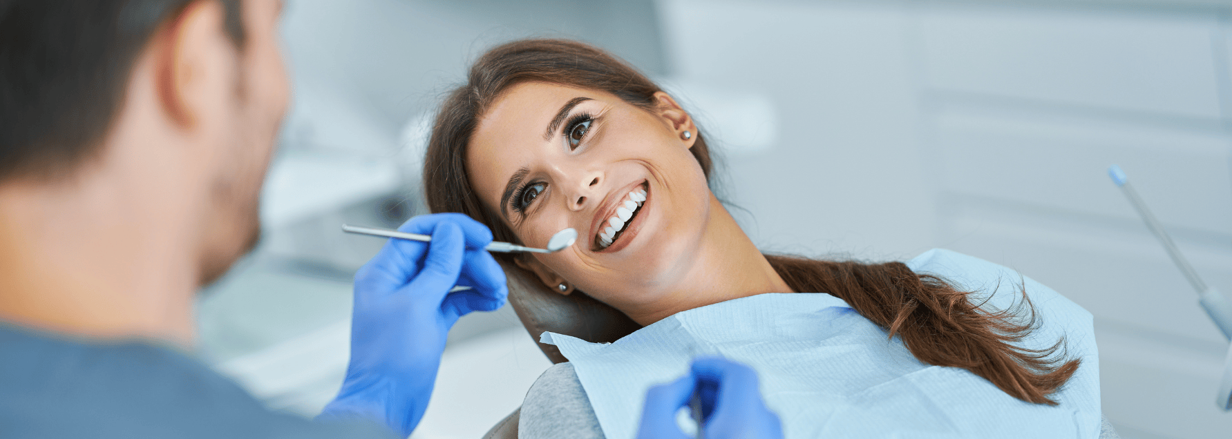 woman smiling at the dentist